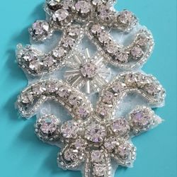 3.5" Crystal Iron On Clear Rhinestone Ornate Pattern Swirling Shapes Applique. The image shows a detailed view of a rhinestone iron-on applique. This 