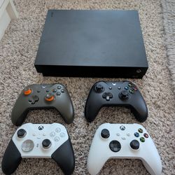 XBOX One X - 1TB ( 4 Controllers Included)