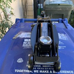 Husky 2 Ton Trolly Floor Jack. New In The Original Box.