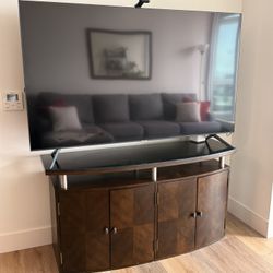 Curved-front TV stand with a granite