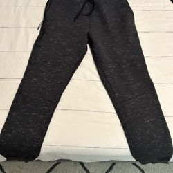 Used Nike Tech Fleece Joggers. Color Heather Grey. Size Medium