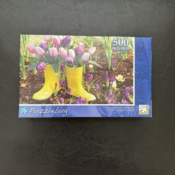 Puzzlebug 500 piece " Yellow Boots In The Garden"  Puzzle