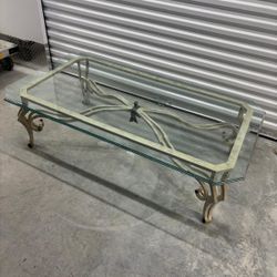 Iron base & glass coffee table- has a  tiny chip on under  the glass.  60 “ wide , 33” depth , 18 “