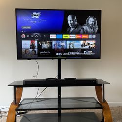 55” TV w/ Stand, Sound Bar, And Sub