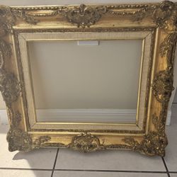 “Gold Antique baroque-style frame”