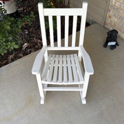 A Small White Rocking Chair 