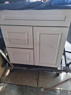 Bathroom vanity , cabinet , thirty wide , twenty two deep thirty four high , great shape all wood