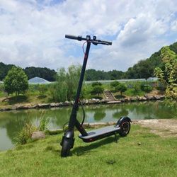 Portable, folding, electric scooter