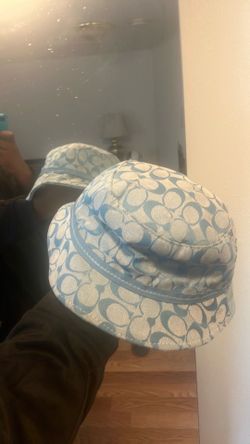 Coach hat used politely used. It’s a denim styled coach hat, rain resistant and it’s fashionable wear is really hard gene, but it is still brand new e