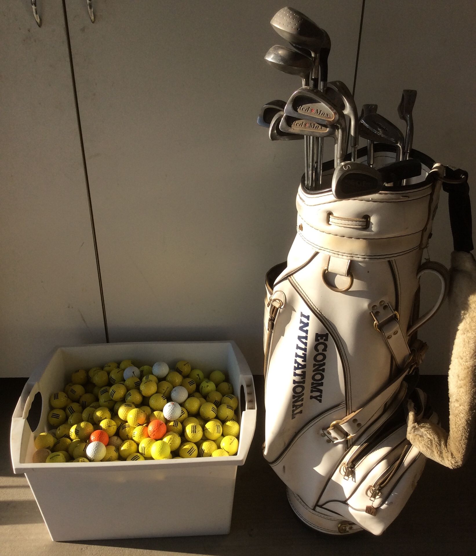 Golf clubs and bag with over 300 balls. 12 clubs and putter.