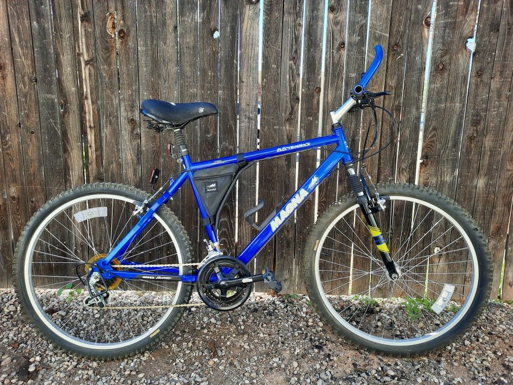 26 Mens Mountain Bike Blue Magna Electroshock 18 Speed Bicycle for Sale in Tucson AZ OfferUp