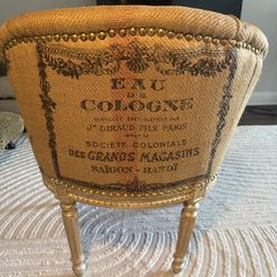 Arm Chair Wit Gold Legs Written In French 