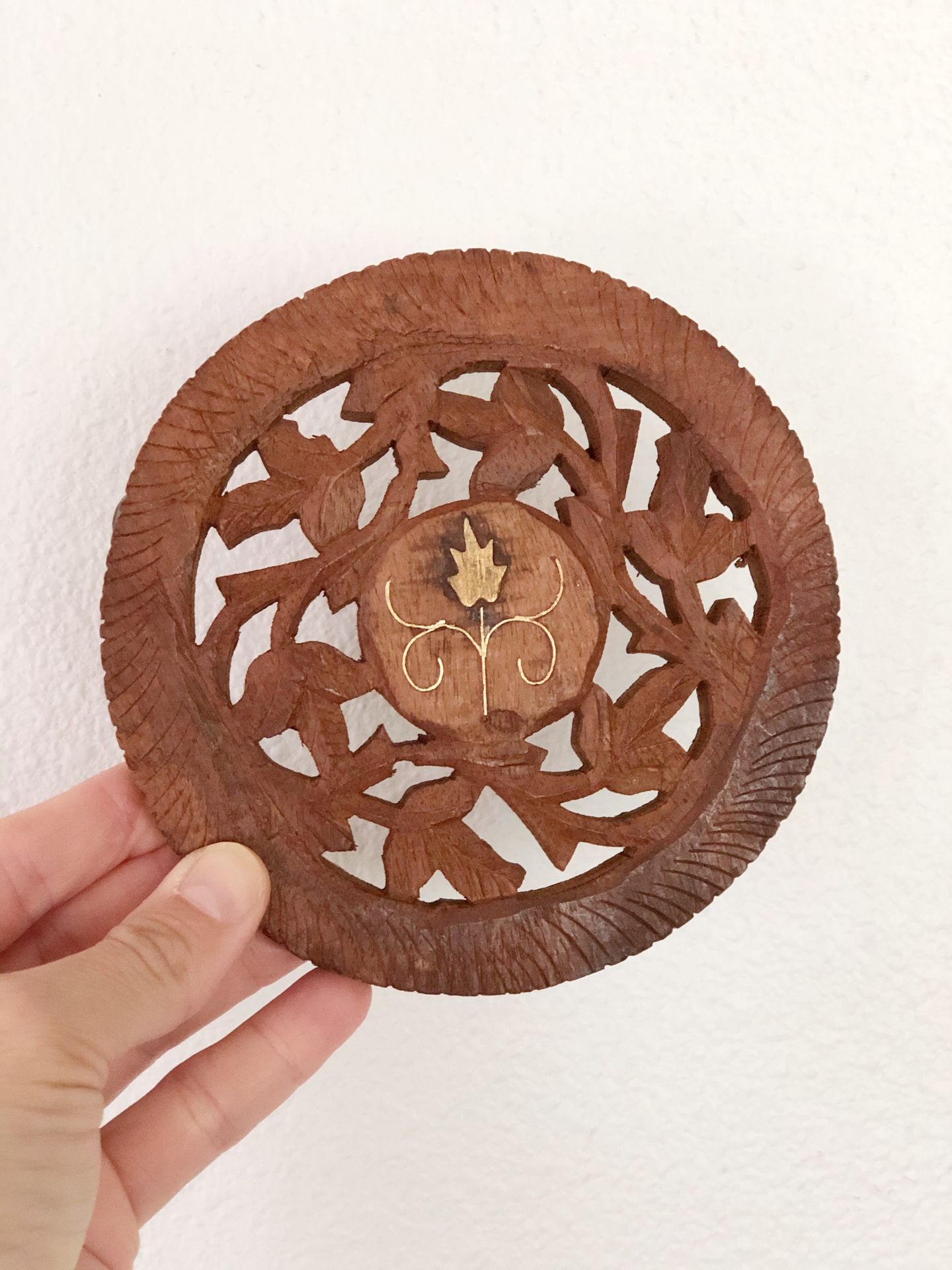 Carved wood trivet with brass inlay / made in India / 5” wide / $10