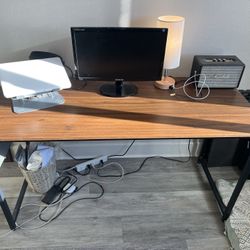 Dark wood desk and office chair 