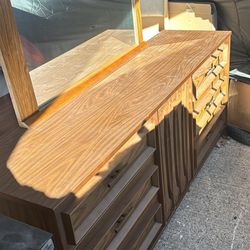 Vanity With A Mirror And Cabinets