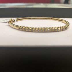 14k solid gold diamond bagle breaclte 15 grams layway available 10% down if you interested ask for Maribel thank you