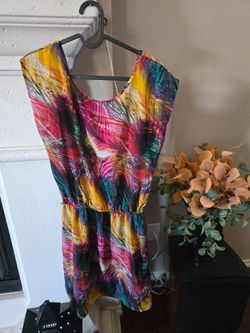 Vibrant multicolor abstract print sleeveless dress. Lightweight, breathable fabric for all-day comfort. Elastic waist creates a flattering silhouette.