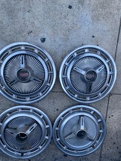 Set 4 14” 1965 Chevy Impala hub caps, good condition, 1- missing SS badge, sell all 4 $175.00 cash