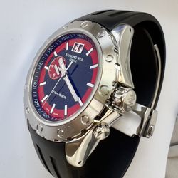 Elegant and sporty Raymond Weil men’s watch with a stainless steel case, black dial with red accents, and anti-reflective sapphire crystal. Swiss quar
