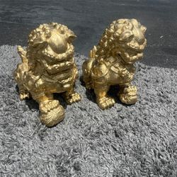 Two golden Asian dragon statues made of resin … 12 “ high , 12” long , 7 “ depth.