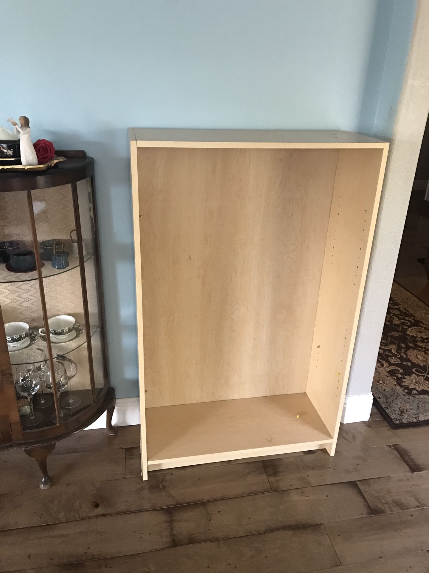 Two IKEA bookcases - both have shelves but one needs new pegs to hold shelving.