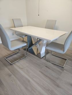Modern dining table with four chairs