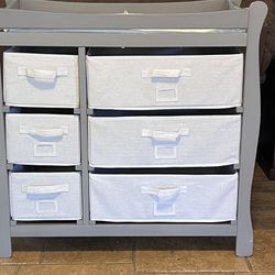 Gray changing table with drawers