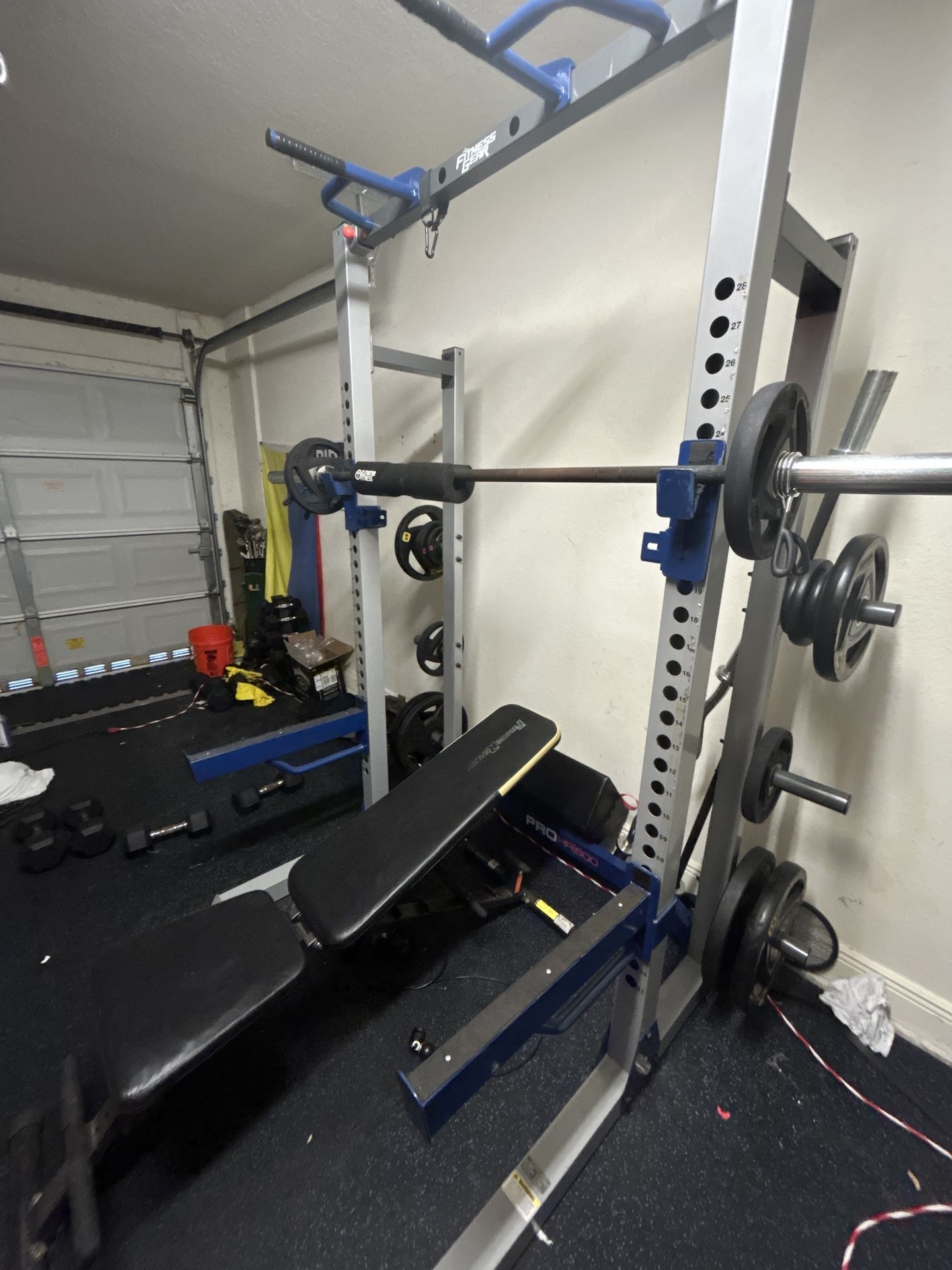 Squat Rack, Bars, Bench, and Plates