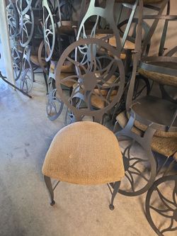 Chair_ padded steel frame sun motif