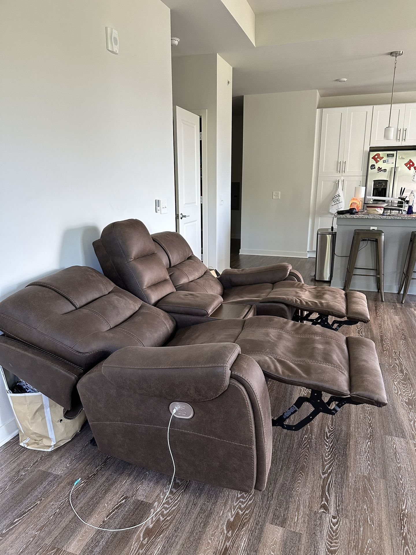 Reclining leather couch with phone chargers