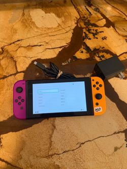 Nintendo Switch with Pink and Orange Joy-Cons