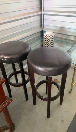 Bar stools some stuff on wood but easy fix no rips in leather