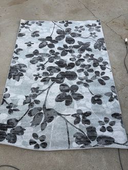 Black and grey floral area rug