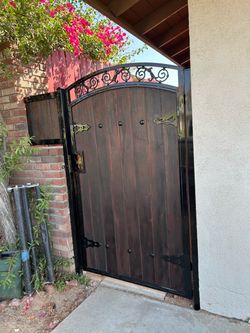 Arched Wood and Wrought Iron Garden Gate