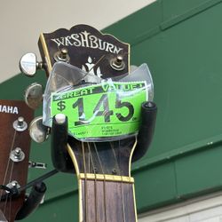 A Washburn Acoustic Guitar