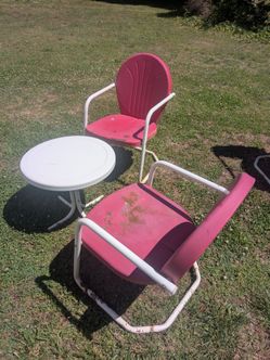 Outside 2 metal chairs and table