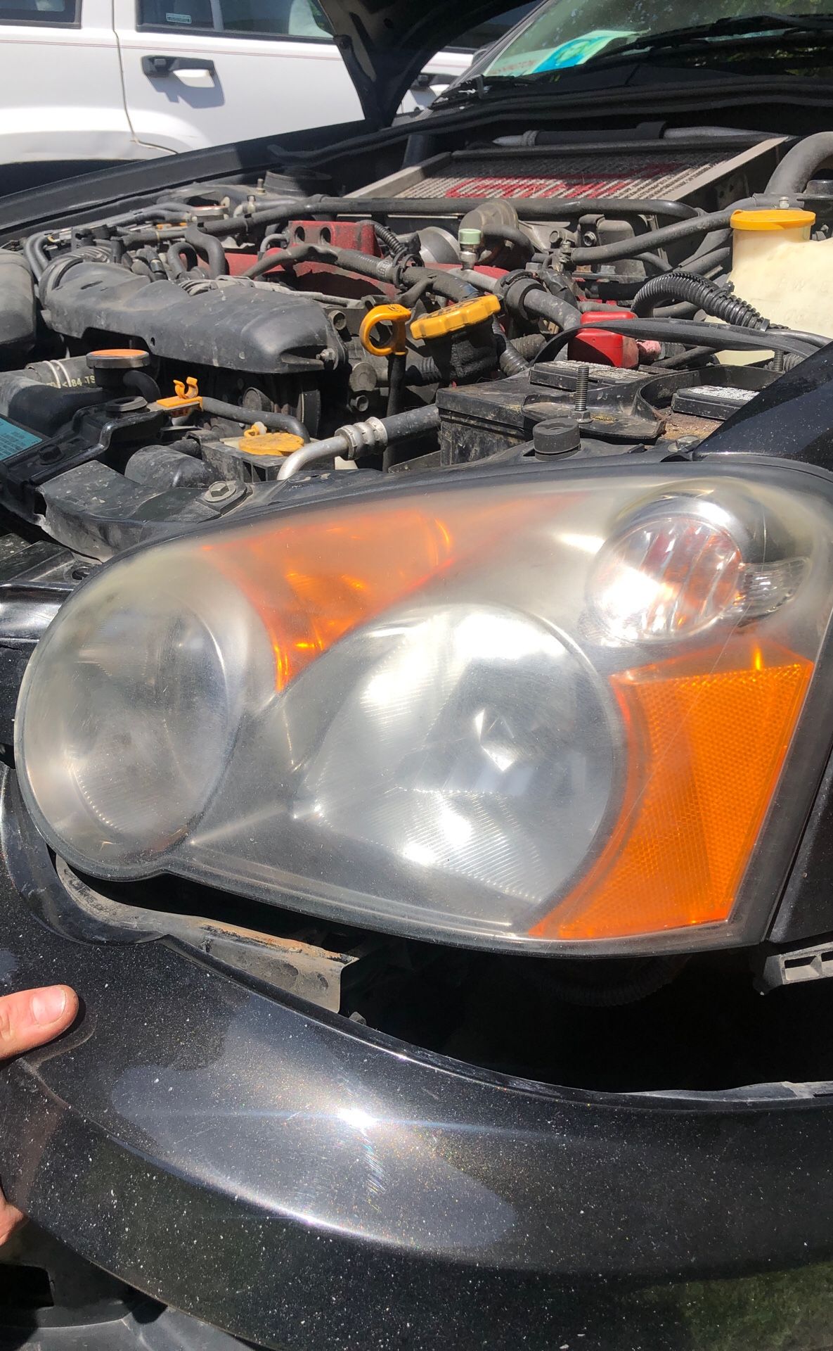 2004 Subaru Impreza headlight with lid