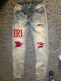 Amiri Distressed Jeans with Red Patches