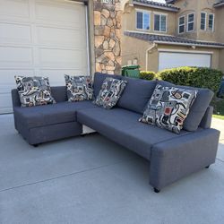 Sectional With Storage, Chaise, Sleeper And Pillows 