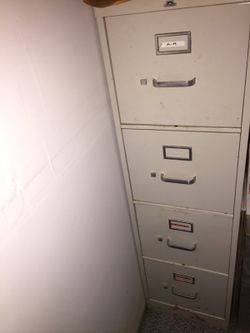 Two four drawer filing cabinets