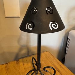 Decorative & Functional Metal  tea light candle holder lamp featuring a decorative shade with swirl cutouts