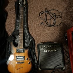 Mitchell Electric Guitar With Amp, Cord, Extra Strings ,And Carrying Case!