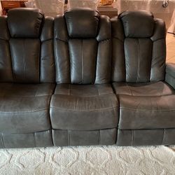 Grey Leather Recliner With Fold Down Cup Holders And Reading Lights 