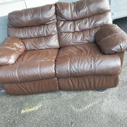 Brown double recliner, leather sofa wall hugger.