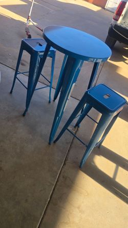 Blue metal patio table with 2 stools