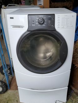 Kenmore elite White washer dryer set with pedestals..