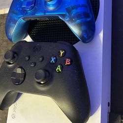 Xbox series S with 2 controllers.