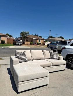 Living Spaces Beige Reversible Couch Sectional