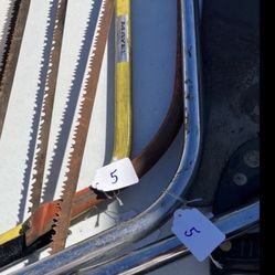 Several Bow Saws and Hand Saws