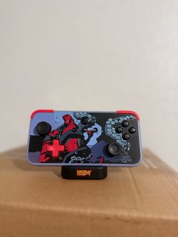 NEO S Hellboy Special Edition with Charging Dock & 5-Fret Guitar Grip Attachment